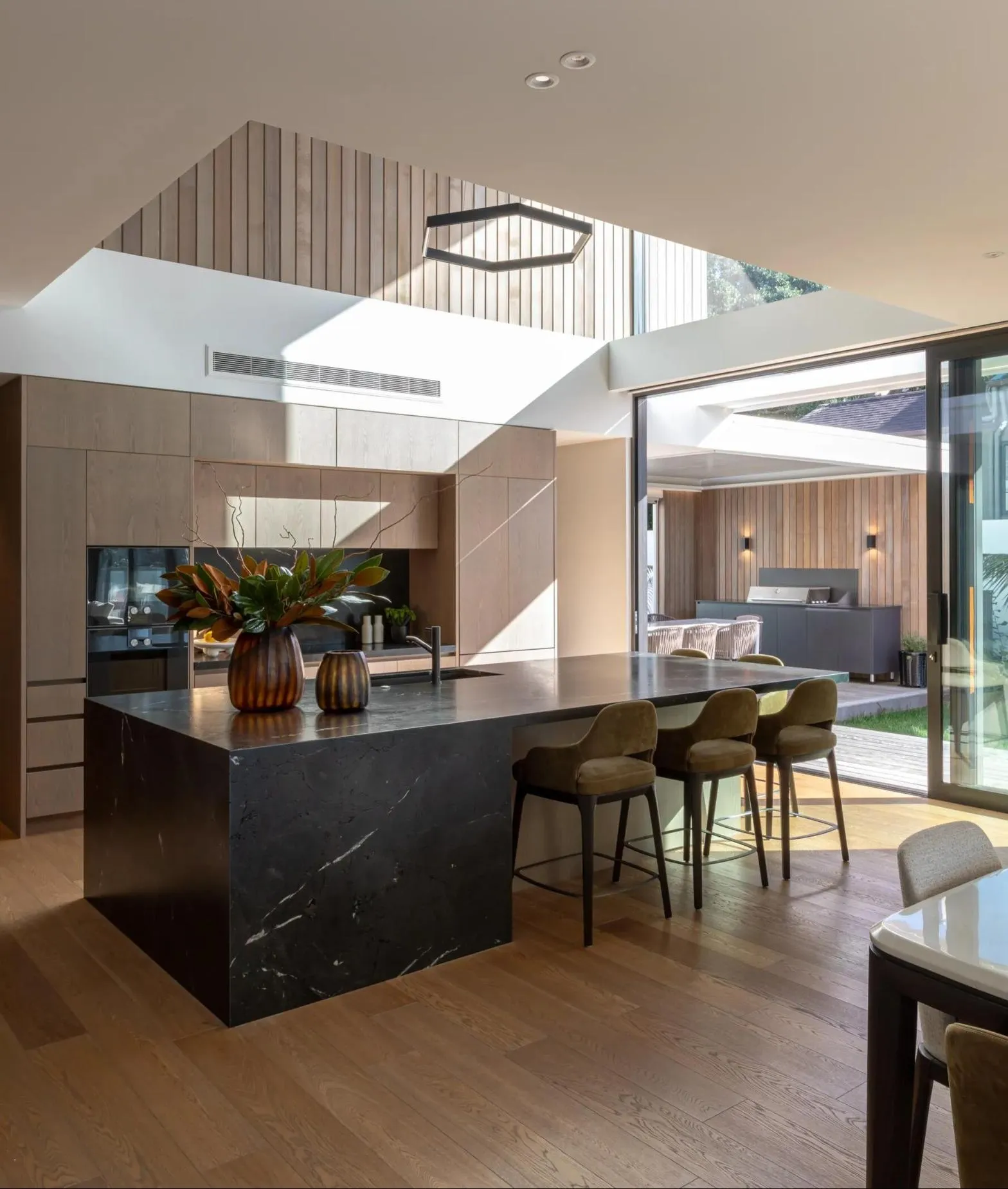 Stone kitchen island beside the open terrace