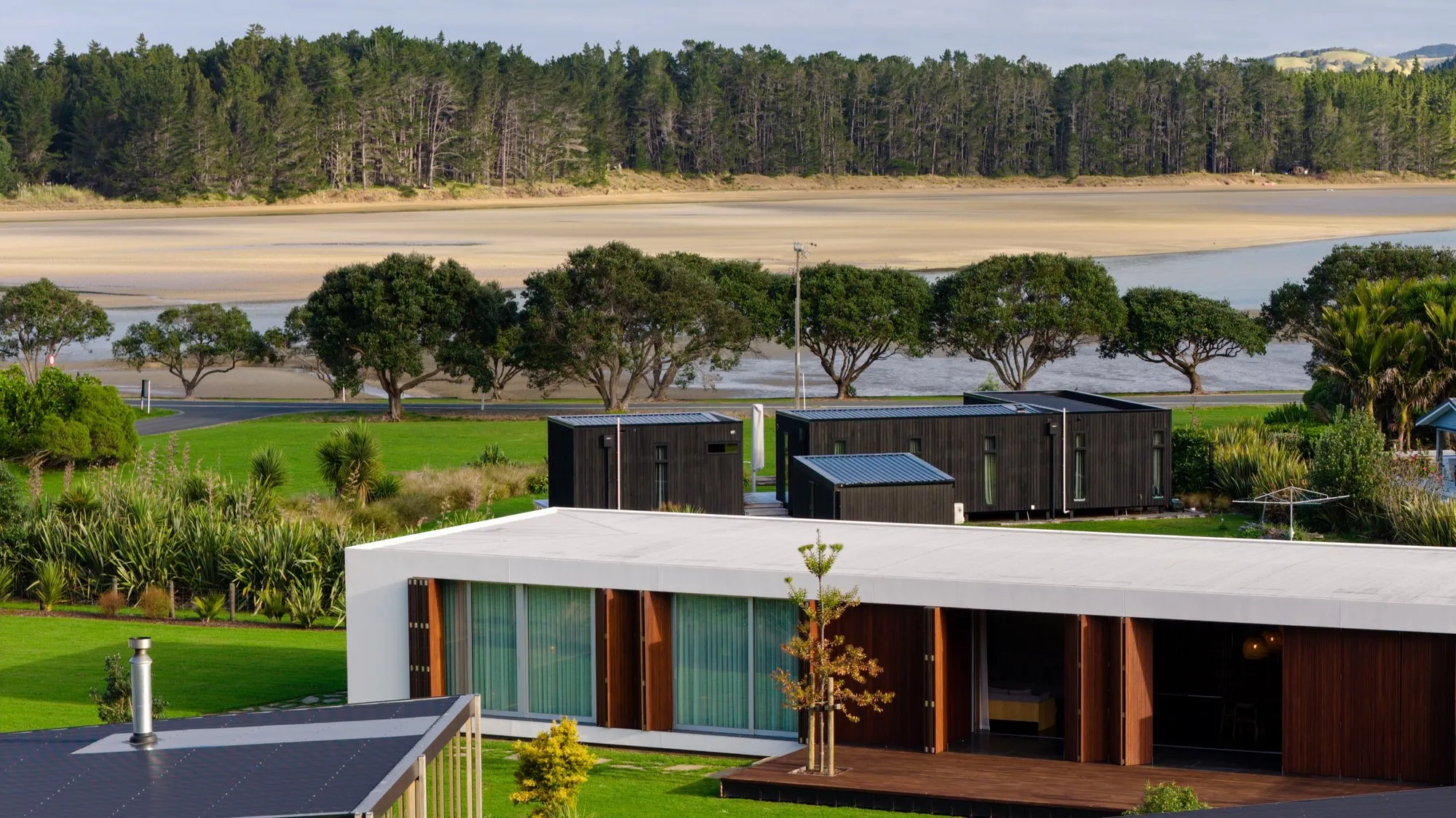 Low timber home looking out over the estuary
