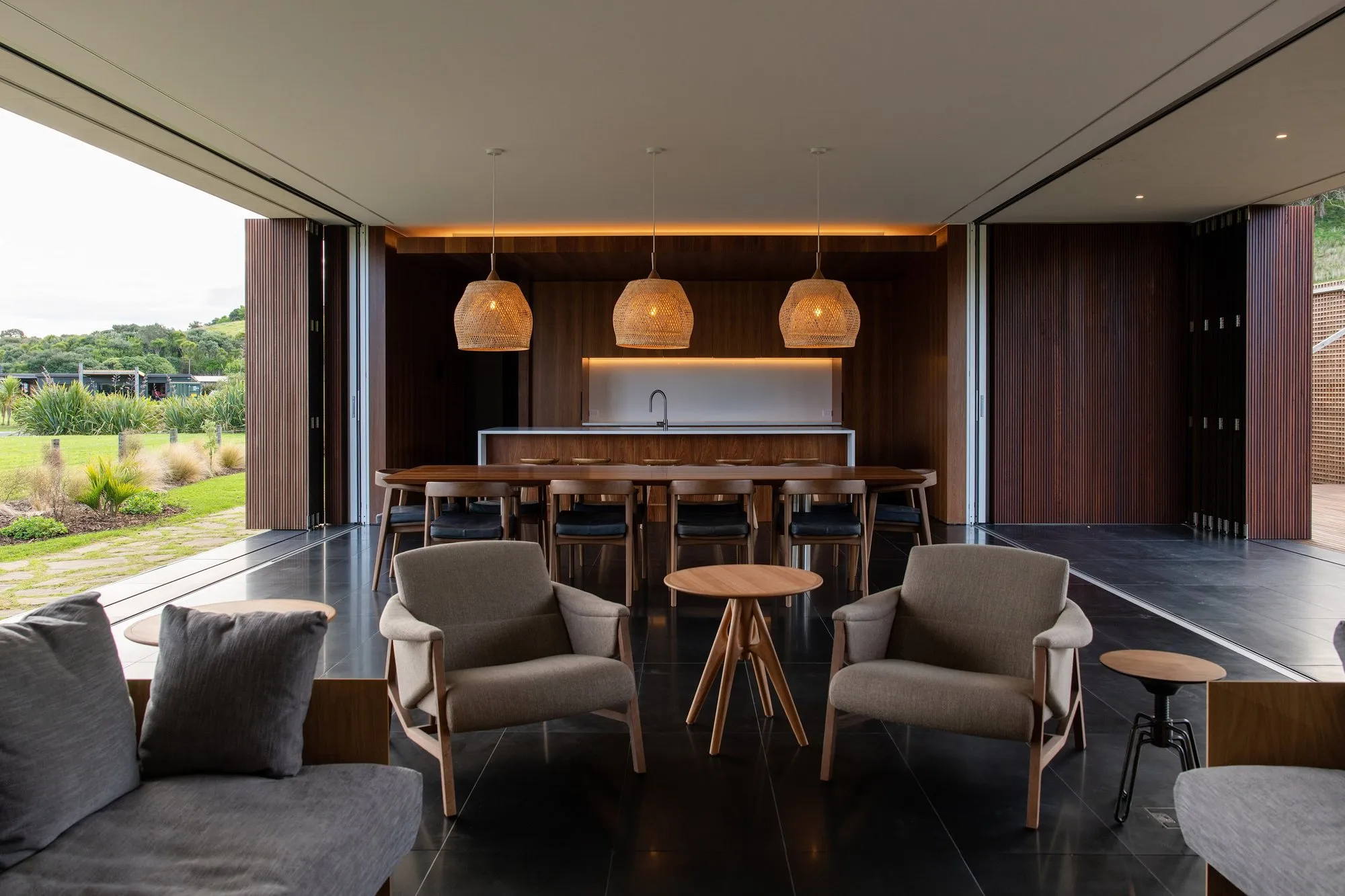 Open-plan living and kitchen opening to the landscape